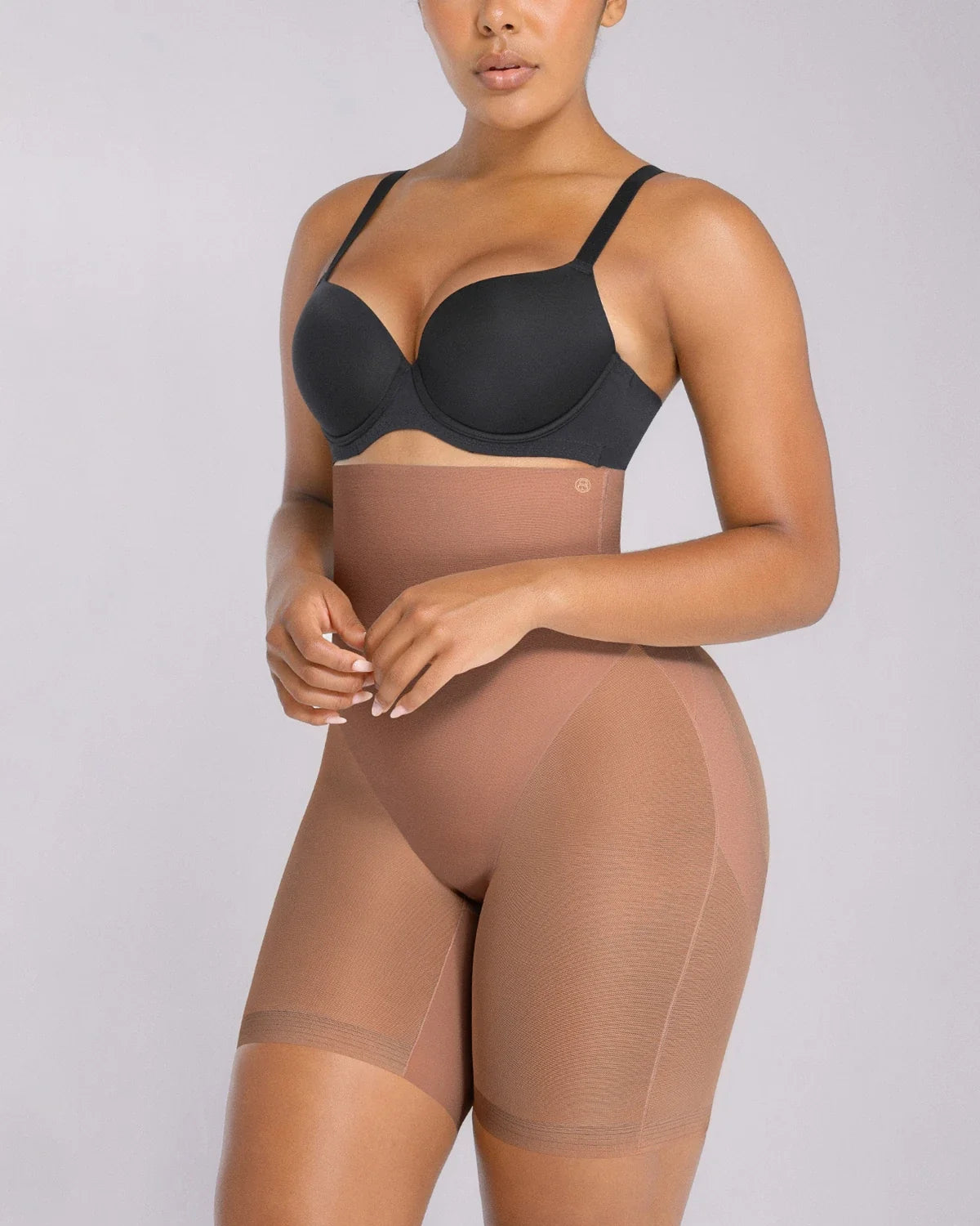 Side view showing waist shaping and tummy smoothing effect of mesh shorts